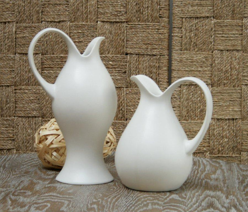 Set of 2 Ivory Pitchers